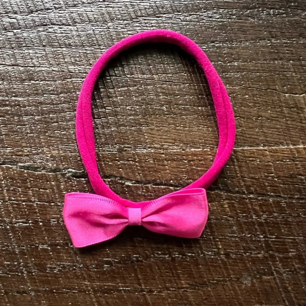 Newborn stretchy headband with pink satin bow